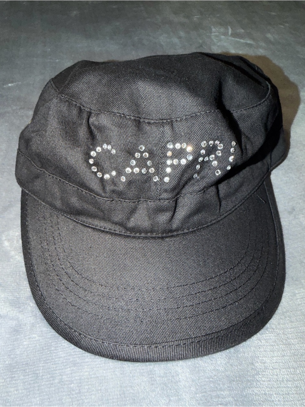 🖤 Grommet Newsboy Cap with Rhinestone “CAPRI” Detail